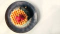 Homemade Viennese waffles with ripe raspberries. Top view Royalty Free Stock Photo