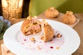 Homemade violet profiterole in a plate.