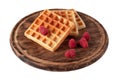 Homemade waffles with berries on wooden board isolated. Belgian waffle with fruit raspberry on white background.