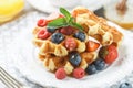 Homemade waffles with ice cream and fresh berries Royalty Free Stock Photo