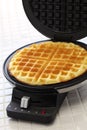 Homemade waffles by waffle maker machine Royalty Free Stock Photo