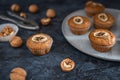 Homemade Walnut and banana muffins on dark background. Side view Royalty Free Stock Photo