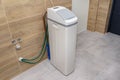 Homemade water softener standing in the boiler room with the lid closed. Royalty Free Stock Photo