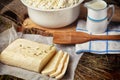 Homemade wheel of cheese ang pitcher of milk. Royalty Free Stock Photo