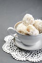 Homemade white chocolate and coconut sweets in a cup on the table. Royalty Free Stock Photo