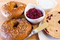 Homemade whole grain bagels with sesame seeds and cranberries.
