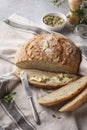 Whole grain bread and slice with pumpkin seeds and butter Royalty Free Stock Photo