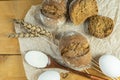 Homemade whole grain bread, wheat grains and spikelets. Spikelets of wheat, bread, flour and egg. Spikelets, fresh wheat bread Royalty Free Stock Photo