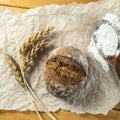 Homemade whole grain bread, wheat grains and spikelets. Spikelets of wheat, bread and flour. Spikelets, fresh wheat bread Royalty Free Stock Photo