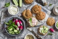 Homemade whole grain rolls, cottage cheese, fresh vegetables - radishes, cucumbers, lettuce and sandwiches with cheese, radish and Royalty Free Stock Photo