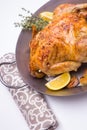 Homemade roasted chicken with lemon on white Royalty Free Stock Photo