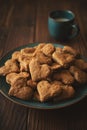 Homemade wholegrain cookies with oatmeal, raisin, nuts, seeds and milk on brown rustic wooden background. Healthy eating concept