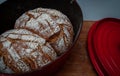 Homemade wholemeal bread in a dutch oven ,cast iron pan Royalty Free Stock Photo