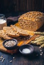 Homemade wholemeal spelt bread with sunflower seeds and baking ingredients