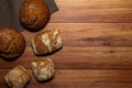 Homemade wholemeal various tastes loaves on a gray dishcloth. Royalty Free Stock Photo