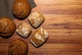 Homemade wholemeal various tastes loaves on a gray dishcloth. Royalty Free Stock Photo