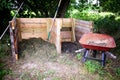 Homemade Wooden 2 Stage Compost Bin with Whell Barrow in the Gar