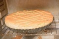 Homemade yeast dough pie baked in oven. Cooking sweet pastries. Close-up, selective focus Royalty Free Stock Photo