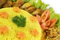 Homemade yellow rice with side dishes on table