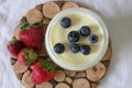 Homemade Yoghurt in a Jar with Fresh Strawberries and Blueberries on a Wooden Background Royalty Free Stock Photo