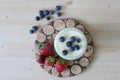 Homemade Yoghurt in a Jar with Fresh Strawberries and Blueberries on a Wooden Background Royalty Free Stock Photo