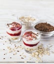 Homemade yogurt with berry jam, linseed and oat flakes