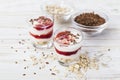 Homemade yogurt with berry jam, linseed and oat flakes