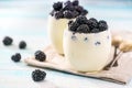 Two bowl of yogurt on wooden background