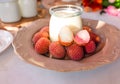 Homemade yogurt and fresh lychee in glass jars, selective focus. Healthy Food Royalty Free Stock Photo