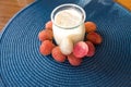 Homemade yogurt and fresh lychee in glass jars, selective focus. Healthy Food Royalty Free Stock Photo