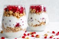 Homemade yogurt parfait with granola and pomegranate fruit