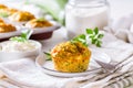 Homemade zucchini muffins with feta cheese and herbs