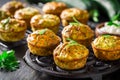 Homemade zucchini muffins with feta cheese and herbs