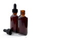 Homeopathic remedy and liquid tincture medicines concept with close up on two brown medicine glass bottles, one open and one Royalty Free Stock Photo