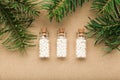 Homeopathy border background, globules in bottles and pine on cork background Royalty Free Stock Photo