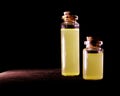 Homeopathy oil in vintage bottles black background. A bottle of homeopathic remedies. Royalty Free Stock Photo