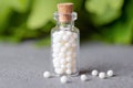 Homeopathy pills in vintage bottle close up