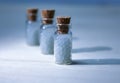 Homeopathy pills in vintage bottles on white background. Royalty Free Stock Photo