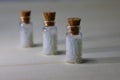 Homeopathy pills in vintage bottles on white background. Royalty Free Stock Photo