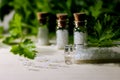 Homeopathy pills in vintage bottles on wood and green background. Royalty Free Stock Photo