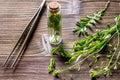 Homeopathy. Store up medicinal herbs. Herbs in glass on wooden table background