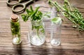 Homeopathy. Store up medicinal herbs. Herbs in glass on wooden table background Royalty Free Stock Photo