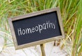 Homeopathy - wooden chalkboard with text