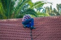 Homeowner fixing the roof of his property