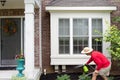 Homeowner washing down the bay windows