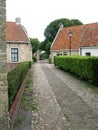 Homes with gardens at a narrow street Royalty Free Stock Photo