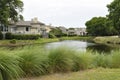 Homes by pond Royalty Free Stock Photo