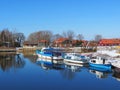 Homes and ships in river Minija in winter , Lithuania Royalty Free Stock Photo