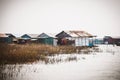 Homes on stilts on the floating village of Kampong Phluk, Tonle Sap lake, Siem Reap province, Cambodia Royalty Free Stock Photo