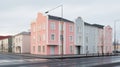 Minimalist Neoclassical Architecture With Soft Colored Installations In Akureyri